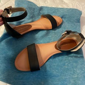 Tommy Hilfiger wedge sandals in black.